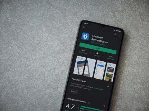 Microsoft Authenticator app play store page on the display of a black mobile  Stock Photos
