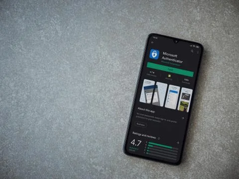 Microsoft Authenticator app play store page on the display of a black mobile  Stock Photos