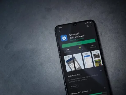 Microsoft Authenticator app play store page on the display of a black mobile  Stock Photos