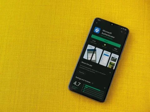 Microsoft Authenticator app play store page on the display of a black mobile  Stock Photos