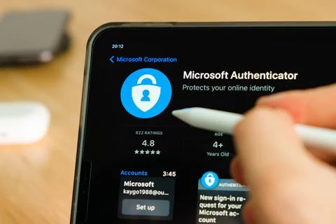 Microsoft authenticator logo shown by apple pencil on the iPad Pro tablet screen Stock Photos