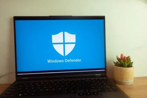 Microsoft Defender Antivirus logo displayed on laptop Stock Photos