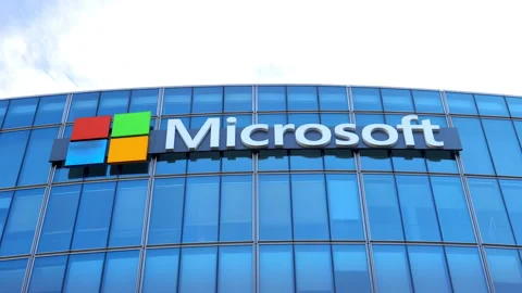 Microsoft logo on the headquarters building in Issy les Moulineaux near Paris Stock Footage 256768038