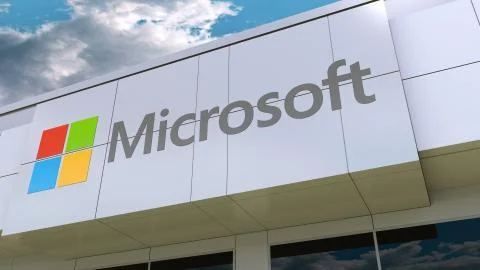 Microsoft logo on the modern building facade. Editorial 3D rendering 스톡 일러스트
