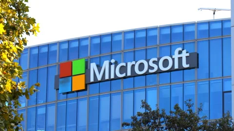 Microsoft logo at the top of the headquarters building in Issy les Moulineaux Stock Footage 256767876