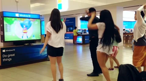 Microsoft staff demonstrates with people dance game Stock Footage 52805111