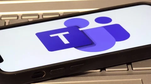 Microsoft Teams platform logo displayed on mobile phone Stock Footage 324705901