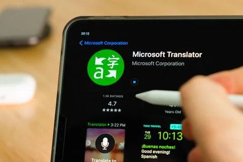 Microsoft Translator logo shown by apple pencil on the iPad Pro tablet screen Stock Photos