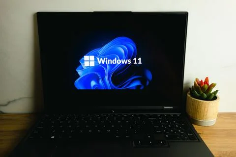 Microsoft Windows 11 operating system logo on laptop Stock Photos