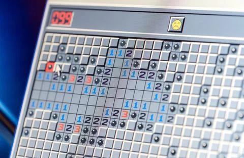 Microsoft Windows XP classic Minesweeper game opened on an old retro laptop.. Stock Photos