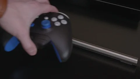 Microsoft XBOX Controller Picking Up Putting Down Stock Footage 120613360