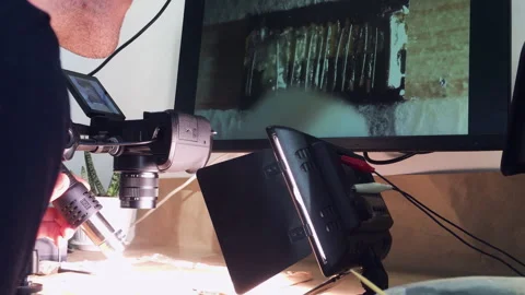 Microsoldering in the home laboratory. Lots of different equipment. Light walls Stock Footage 240894200