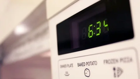 Microwave door open and baked potato button hit on interface Video stock 70337088