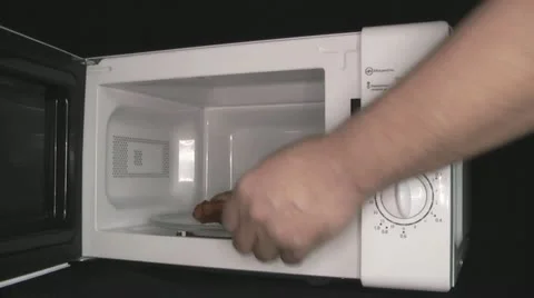 Microwave oven in the kitchen assistant Stock Footage 22255378