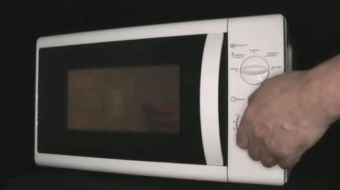 Microwave oven in the kitchen assistant Stock Footage 22255431