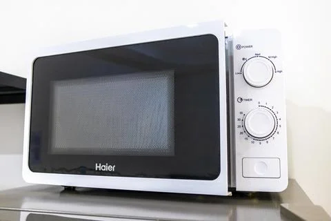 Microwave oven provided inside a hotel room for convenient guest use Thailand Stock Photos