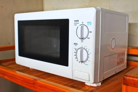 Microwave oven on the table Stock Photos