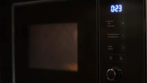Microwave, timer. the concept of cooking semi-finished products. Stock Footage 234821185