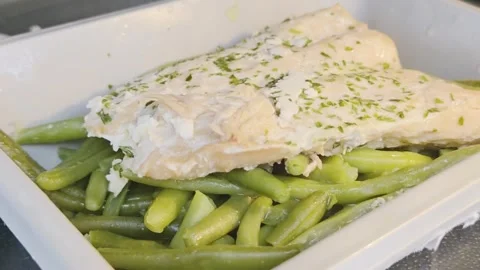 Microwaved Salmon with Steamed Green Beans Stock Footage 320396515