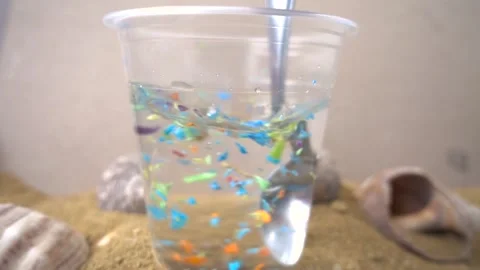 Micrplastics being poured form hand. Stock Footage 147154646