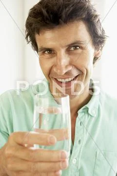 Mid Adult Man Drinking A Glass Of Water Stock Photos