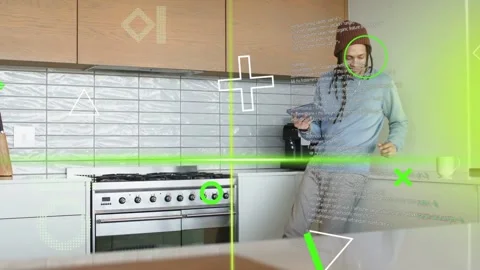 Mid-adult man interacting with tablet in kitchen, generating tech overlays Stock Footage 333670688
