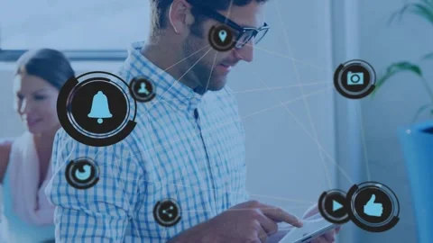 Mid-adult man tapping tablet screen, showcasing digital workflow in tech office Stock Footage 328155408