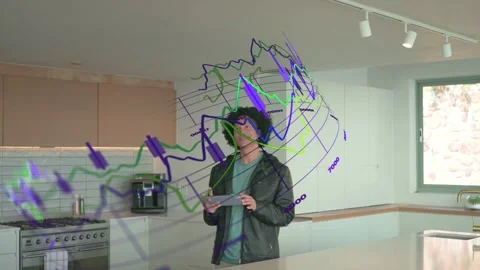 Mid-adult man tapping tablet in kitchen and monitoring finance with 3D graphs Stock Footage 333526289