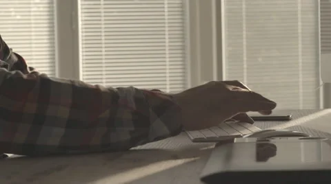 Mid adult man typing on computer keyboard Stock Footage 63625092