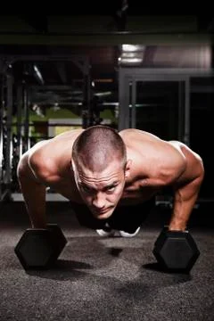 Mid adult man working out in gym Stock Photos