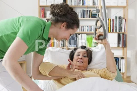 Mid Adult Woman Helping Senior Woman