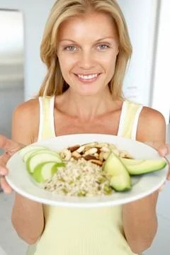 Mid Adult Woman Holding Plate With Healthy Foods Stock Photos