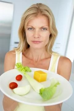 Mid Adult Woman Holding A Plate Of Healthy Food Stock Photos