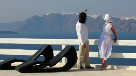 Mid age couple on balcony Stock Footage 24633340