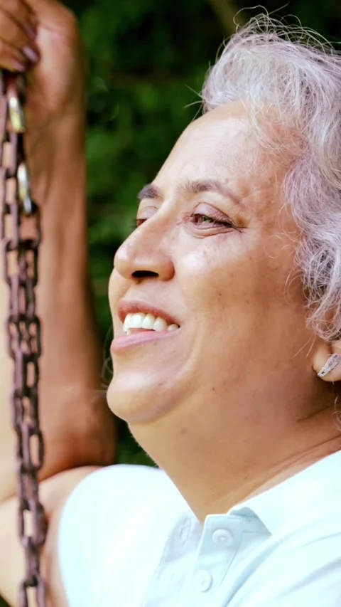 Mid age Indian couple in the park, smiling, chatting Stock Footage 343360726