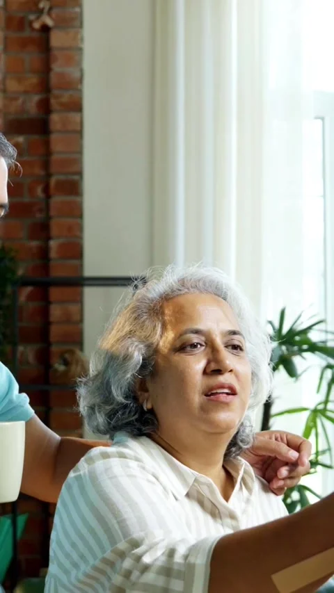 Mid age Indian couple spending peaceful time together at home Video stock 343361188