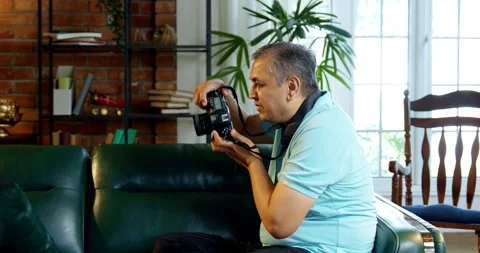 Mid age Indian couple spending peaceful time together at home Stock Footage 343364741