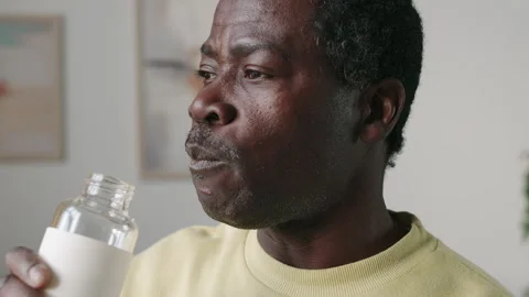 Mid Aged Black Man Drinking Water after Home Workout Video stock 268796108