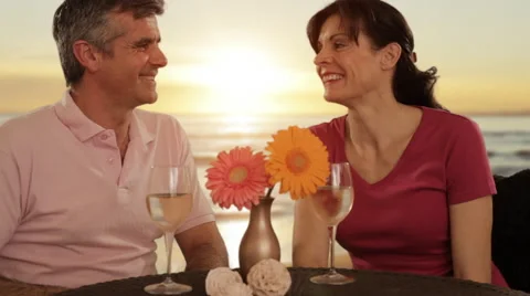 Mid aged couple in beach cafe Stock Footage 43676631