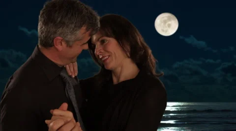 Mid aged couple dancing in moonlight Stock Footage 43676645