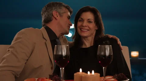 Mid aged couple dining in moonlight Stock Footage 43676742