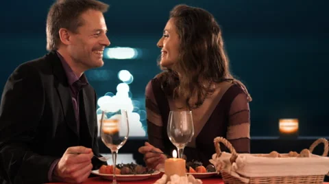 Mid aged couple at dinner Stock Footage 43675902