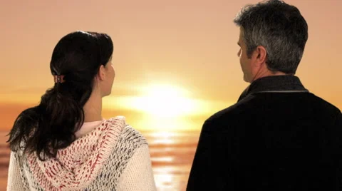 Mid aged couple in sunset Stock Footage 43676472