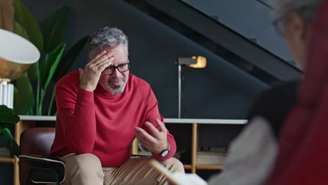 Mid-Aged Man Having Conversation with Therapist during Psychology Consultation Stock Footage 317733256