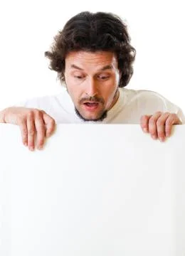 Mid-aged man looking down on a sign Stockfoto's