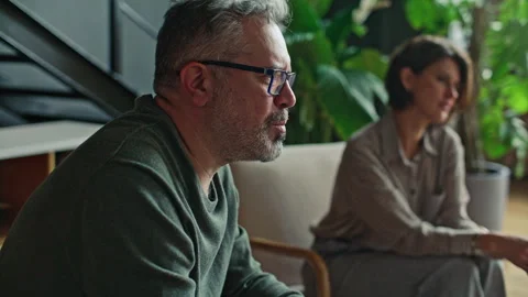 Mid-Aged Married Couple Talking to Psychologist during Therapy Session Stock Footage 317733108