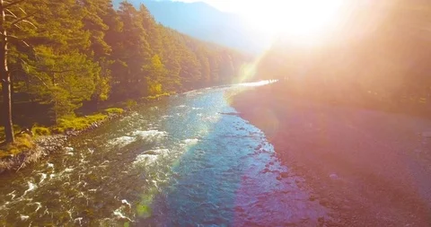 Mid air flight over fresh and clean mountain river at sunny summer morning Stock Footage 99362846
