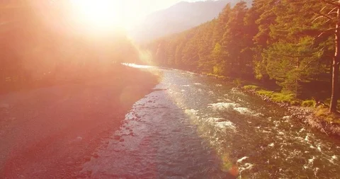 Mid air flight over fresh and clean mountain river at sunny summer morning Video stock 119896584