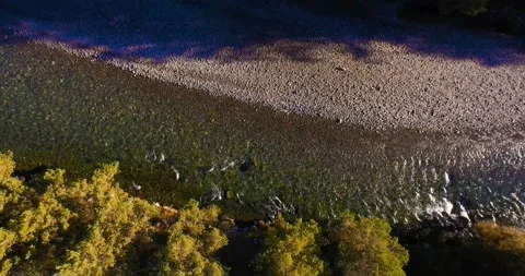 Mid air flight over fresh and clean mountain river at sunny summer morning Stock Footage 139983165