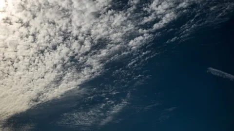 Mid and High Level Clouds Cross Blue Sky Time Lapse Stock Footage 285010442